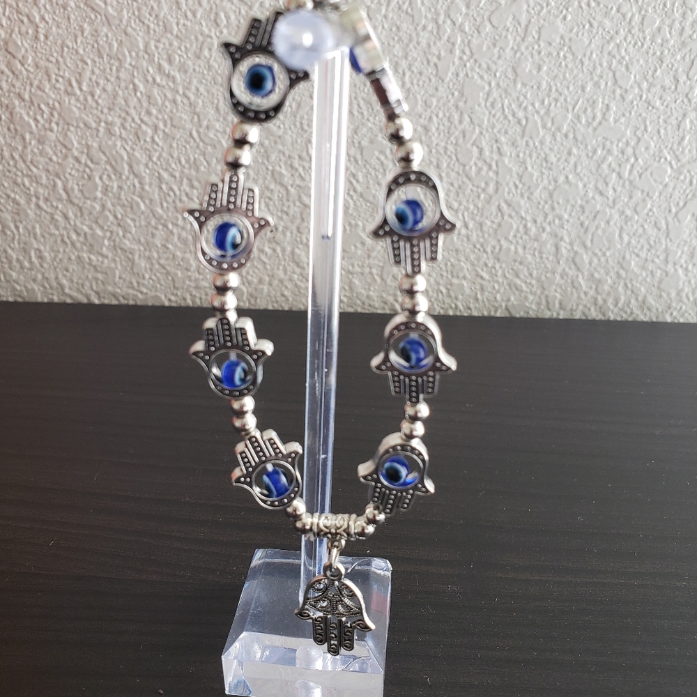 Elastic Silver Hamsa hand and evil eye 2 ancient symbols Protection/prosperity.